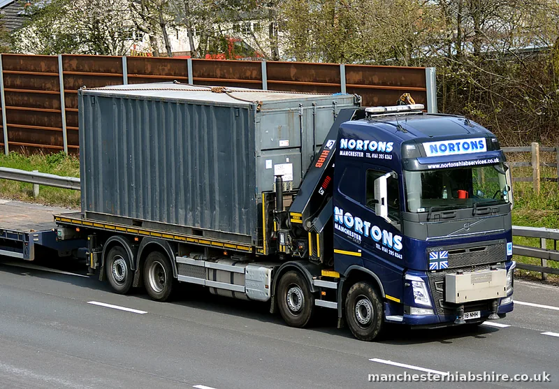 Container load on the bed of a rigid HIAB lorry
