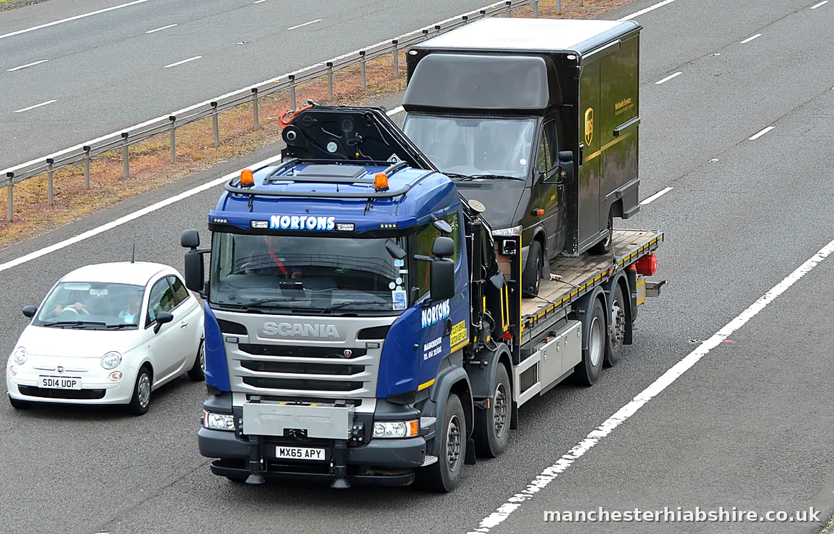 Covered load carried on the bed of a HIAB lorry