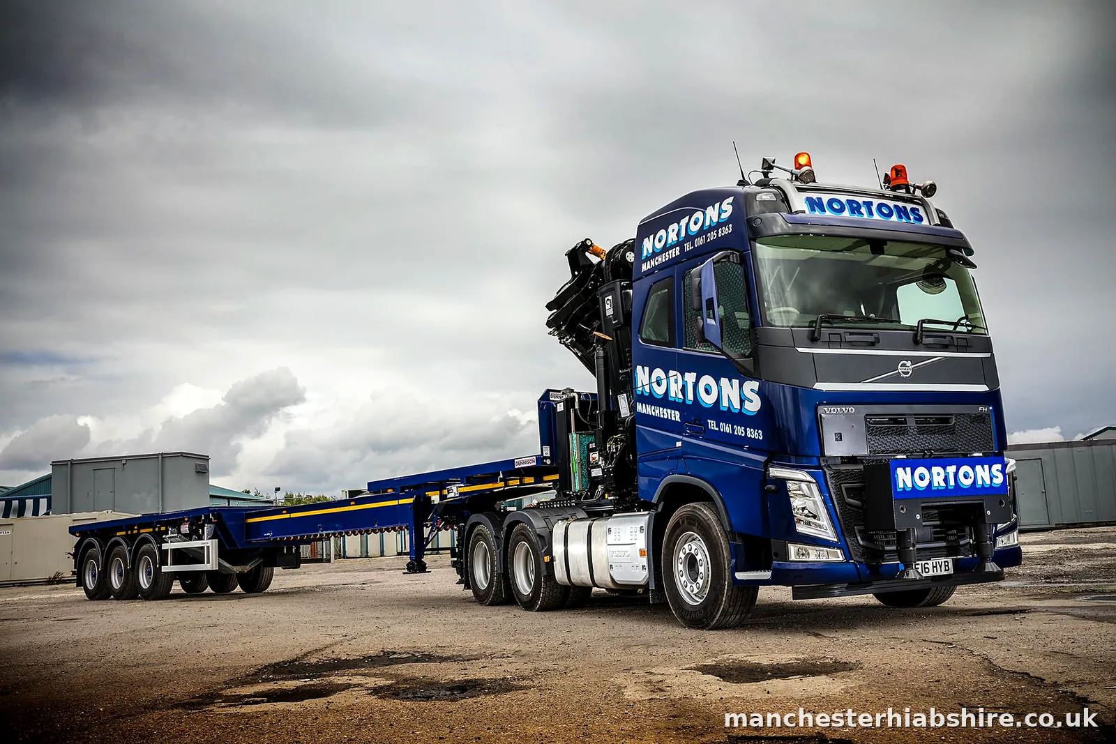 HIAB lorry and trailer outfit standing empty in the yard