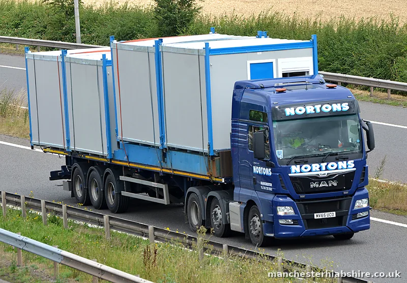 HIAB lorry and trailer carrying cabin units on the motorway
