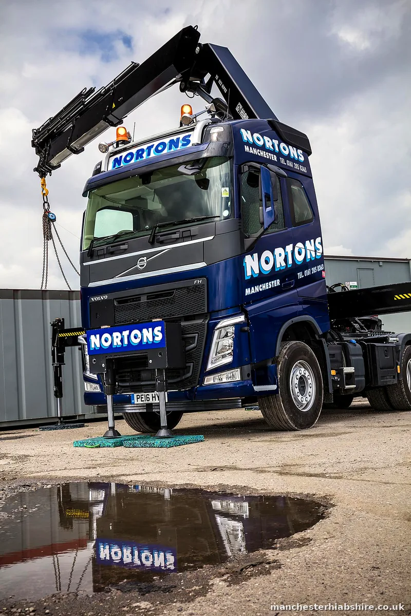 HIAB lorry front three quarter view in the yard after rain