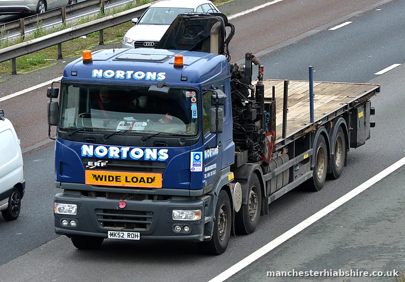 HIAB lorry showing a wide load board on the front bumper