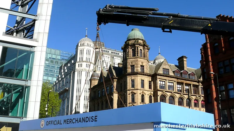 Matchday retail unit chain lifted on the HIAB against Victorian architecture in Manchester
