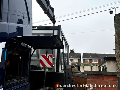 HIAB lorry working in a tight street