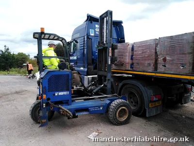 Articulated lorry loaded with wrapped brick packs