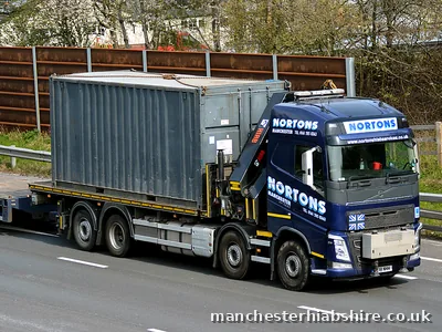Container load on the bed of a rigid HIAB lorry