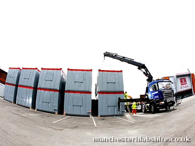 Modular units stacked with crew working alongside at Emirates Old Trafford
