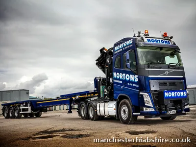 HIAB lorry and trailer outfit standing empty in the yard