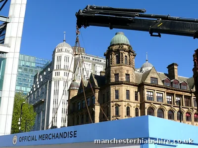 Matchday retail unit chain lifted on the HIAB against Victorian architecture in Manchester