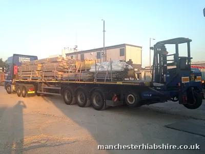 Articulated lorry with a fully loaded scaffold trailer
