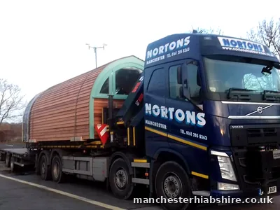 Single cedar clad pod loaded on the trailer