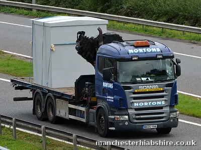 One grey unit carried on the bed of a HIAB lorry