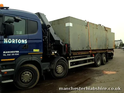 Large rectangular steel tank loaded on the HIAB lorry bed