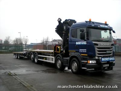 Eight wheel HIAB lorry with a flat trailer, full rig side on