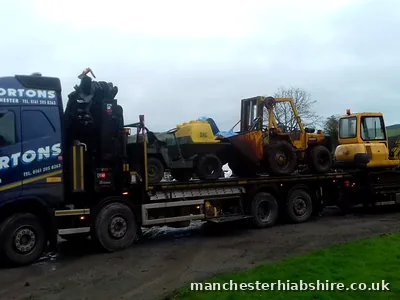 Wagon and drag loaded with a dumper, loading shovel, dozer and excavator